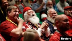 Santas laugh as they learn about Santa Spirit during class at the Charles W. Howard Santa Claus School in Midland, Michigan, Oct. 27, 2016.