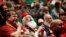 Santas laugh as they learn about Santa Spirit during class at the Charles W. Howard Santa Claus School in Midland, Michigan, Oct. 27, 2016.
