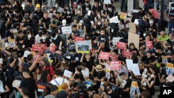 Demonstrators gather during a protest at Hong Kong International Airport, Friday, July 26, 2019.