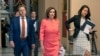 House Speaker Nancy Pelosi of Calif., center, walks towards the House Chamber on Capitol Hill, Jan. 15, 2020, in Washington. 