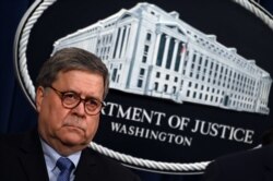 FILE - U.S. Attorney General William Barr holds a press conference at the Department of Justice in Washington, Jan. 13, 2020.