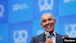 FILE - Former U.S. President Barack Obama takes part in a moderated discussion during a tech start-up conference in Munich, Germany, Sept. 29, 2019.