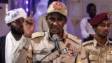 FILE: In this May 18, 2019 photo, Gen. Mohammed Hamdan Dagalo, head of the paramilitary Rapid Support Forces, speaks in Khartoum. Amnesty International said said on June 11, 2019, that the Rapid Support Forces have committed “war crimes and other serious human rights violations.”