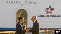 U.S. Secretary of State Marco Rubio, left, shakes hands with Panama Canal Authority Administrator Ricaurte Vasquez during a tour at the Miraflores locks of the Panama Canal in Panama City, Panama, Feb. 2, 2025.