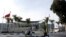 A police officer rides in front of the International Conference Center where the signing of a U.N.-sponsored deal aiming to end Libya's conflict was to take place in Sikhrat, Morocco, Dec.16, 2015. The deal is expected to be signed Thursday. 