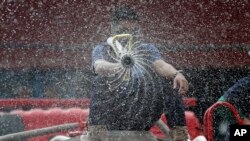 Firemen spray disinfectants outside a public market in Manila, Philippines.