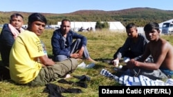 Migrants in front of the temporary reception migrant center Lipa, near Bihac, October 20, 2020.