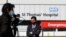 Journalists work outside St Thomas' Hospital in central London as British Prime Minister Boris Johnson was moved to intensive care after his coronavirus symptoms worsened in London, Tuesday, April 7, 2020.