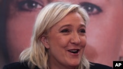 French far-right leader and National Front Party, Marine Le Pen, addresses the media during a news conference, Dec. 7, 2015, in Lille. France's far-right National Front ran strongly in a first-round regional vote that was the first election since an attack by Islamic extremists left 130 dead in Paris. 