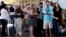 People stand in line at Washington's Reagan National Airport after technical issues at a Federal Aviation Administration center in Virginia caused delays, Aug. 15, 2015.