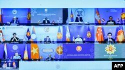 This handout photo taken and released on March 2, 2021 by H2O Images shows foreign ministers and representatives of countries in the Association of Southeast Asian Nations (ASEAN) pictured on a screen during a virtual meeting in Putrajaya, outside Kuala L