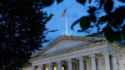 FILE - This June 6, 2019, photo shows the U.S. Treasury Department building at dusk in Washington.