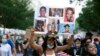 Demonstrators march near the White House, to protest police brutality and racism, on June 10, 2020 in Washington, DC. - Demonstrations are being held across the US following the death of George Floyd on May 25, 2020, while being arrested in…