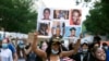 Demonstrators march near the White House, to protest police brutality and racism, on June 10, 2020, in Washington, D.C. 