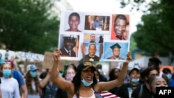 Demonstrators march near the White House, to protest police brutality and racism, on June 10, 2020, in Washington, D.C. 