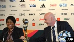 FILE - FIFA president Gianni Infantino and FIFA Secretary General Fatma Samoura pose with the trophy during a press conference in Auckland ahead of the Women’s World Cup football tournament, July 19, 2023.