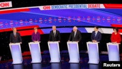 Democratic 2020 U.S. presidential candidates (L-R) billionaire activist Tom Steyer, Senator Elizabeth Warren, former Vice President Joe Biden, Senator Bernie Sander, former South Bend Mayor Pete Buttigieg and Senator Amy Klobuchar in Des Moines, Iowa, U.S., January 14, 2020.