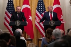 FILE - President Donald Trump speaks during a news conference with Turkish President Recep Tayyip Erdogan in the East Room of the White House, Nov. 13, 2019.
