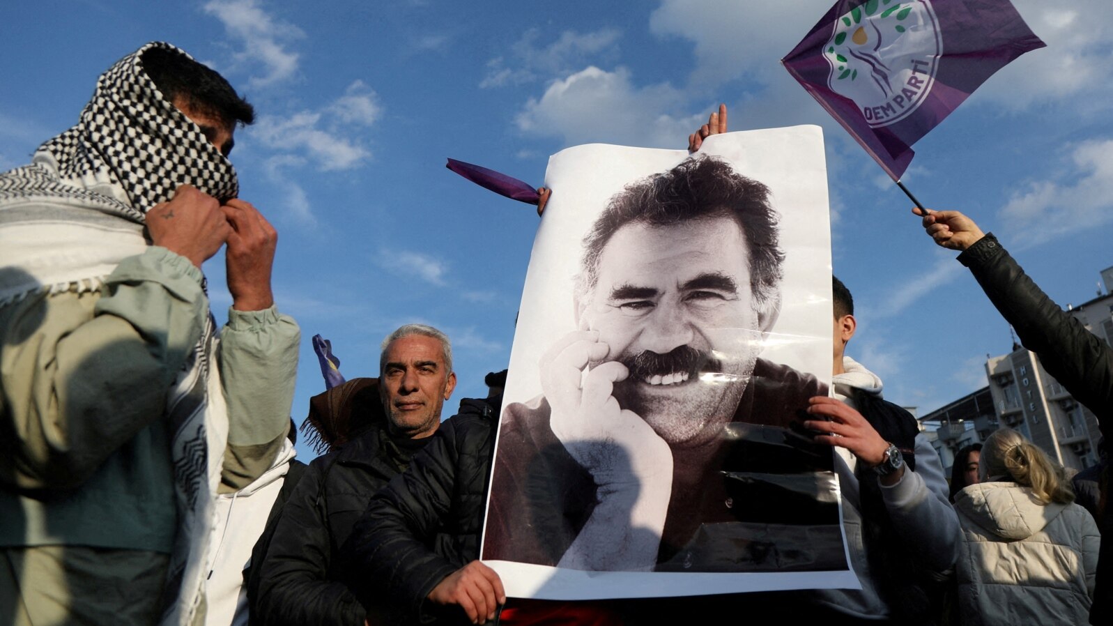FILE - A demonstrator holds a picture of Kurdistan Workers Party leader Abdullah Ocalan during a rally in Diyarbakir, Turkey, Feb. 27, 2025.