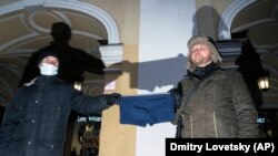 RUSSIA: Protesters at an unsanctioned rally hold a pair of underwear after the leak of a call between dissident Alexey Navalny and one of his alleged assassins reveals the poison was applied to a pair of Navalny's underwear.