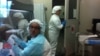 Lab workers at Tbilisi's Richard G. Lugar Center for Public Health Research. (J. Brooke/VOA)