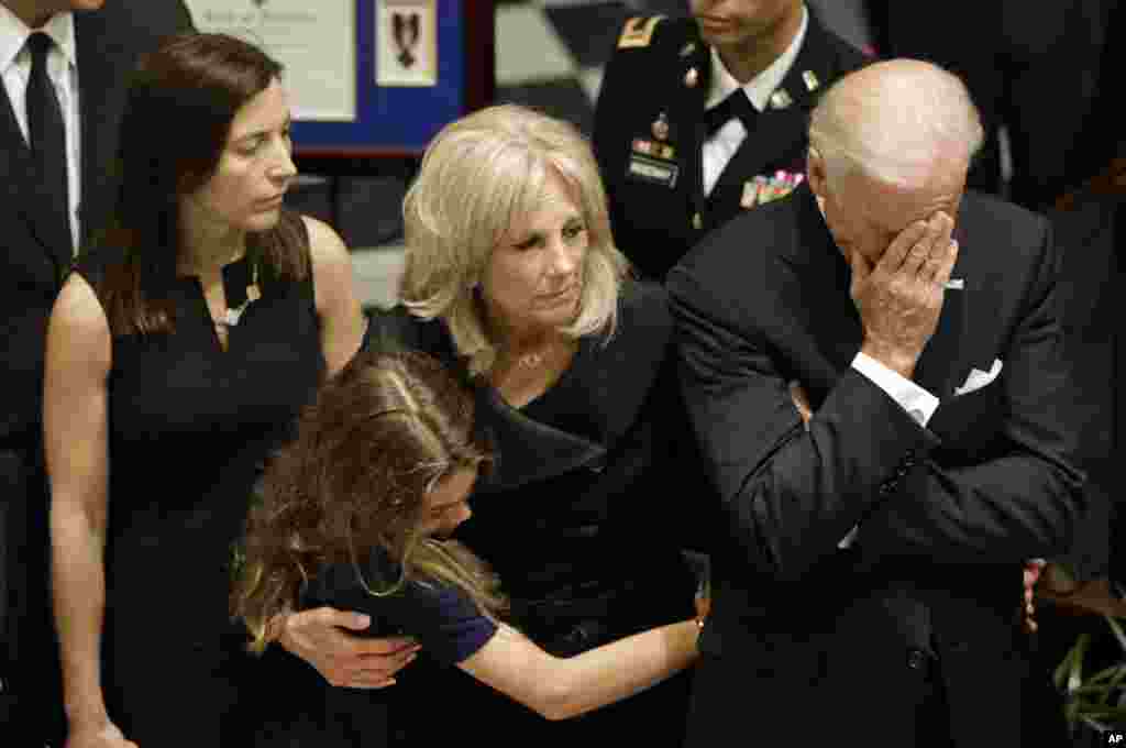 U.S. Vice President Joe Biden rests his head in his hand during a viewing for his son, former Delaware Attorney General Beau Biden, at Legislative Hall in Dover, Delaware, June 4, 2015.