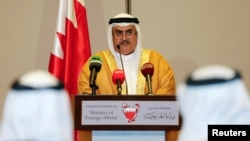 Bahraini FM Sheik Khalid bin Ahmed al-Khalifa reads the joint statement after the foreign ministers of Saudi Arabia, Bahrain, the United Arab Emirates and Egypt meeting to discuss their dispute with Qatar, in Manama, July 30, 2017. 