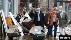 King Philippe and Queen Mathilde of Belgium visit an area affected by floods, following heavy rainfalls, in Pepinster, Belgium, July 16, 2021.