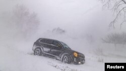 A car drove into a ditch during a winter storm near Wainfleet Ontario, Canada Dec. 24, 2022.