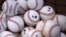 FILE- A basket of baseballs sits on a practice field, Feb. 22, 2015, during a baseball spring training workout in Bradenton, Fla. Facebook is getting deeper into the professional sports streaming game, signing a deal with Major League Baseball to show 25 afternoon games in an exclusive deal.