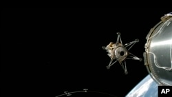 This image from video provided by SpaceX via NASA TV shows Intuitive Machines' lunar lander separating from the rocket's upper stage and heading toward the moon, on Feb. 15, 2024.