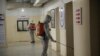 Members of a humanitarian aid agency disinfect Ibn Sina hospital as prevention against coronavirus in Idlib city, Syria, March 19, 2020. 