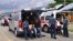 Ambulance workers wait to transport the bodies of the victims of the crashed Trigana Air Service flight at Sentani airport in Jayapura, Papua province, Indonesia, Aug. 18, 2015. 