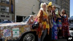 Summer of Love AnniversaryA group of women pose next to a psychedelic Rolls Royce before a ceremony to open an exhibit celebrating the 50th anniversary of the Summer of Love at the California Historical Society, May 12, 2017.