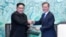 South Korean President Moon Jae-in and North Korean leader Kim Jong Un shake hands at the truce village of Panmunjom inside the demilitarized zone separating the two Koreas, South Korea, April 27, 2018.