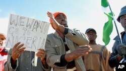Nigerian refugees from Libya protest at the Chucha camp 25km from the Libyan border, calling for assistance from their government in returning home.
