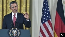 President Barack Obama answers a question during a joint news conference with German Chancellor Angela Merkel in the East Room of the White House in Washington, DC, June 7, 2011