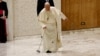 Pope Francis stumbles when part of his walking cane breaks as he arrives to hold the Jubilee audience in Paul VI hall at the Vatican, Feb. 1, 2025. 