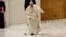 Pope Francis stumbles when part of his walking cane breaks as he arrives to hold the Jubilee audience in Paul VI hall at the Vatican, Feb. 1, 2025. 