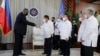 In this photo provided by the Malacanang Presidential Photographers Division, U.S. Secretary of Defense Lloyd Austin, left, does a fist bump with Philippine President Rodrigo Duterte at the Malacanang Palace in Manila, Philippines, July 29, 2021.