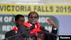 FILE - Zimbabwe President Robert Mugabe addresses people gathered for his 91st birthday celebration in Victoria Falls, Feb. 28, 2015. 