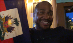 This Haitian soccer fan danced and waved the Haitian flag at Port-au-Prince restaurant in Washington after the team’s 3-2 victory over Canada. (S. Lemaire/VOA)