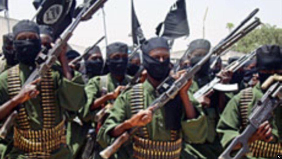 Al-Shabab fighters march with their guns during military exercises on the outskirts of Mogadishu (File)