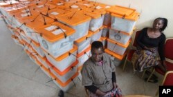 FILE - Polling station workers are seen guarding ballot boxes following presidential elections in Lusaka, Zambia, Jan. 21, 2015.