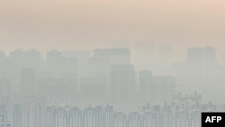 This photo taken on Dec. 25, 2023 shows buildings amid high levels of air pollution in Yinchuan, in China’s northern Ningxia region.