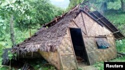 Damaged buildings are seen in the aftermath of a cyclone in Pentecost, Vanuatu, March 7, 2018 in this image obtained from social media.