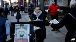 The front page of the London Evening Standard newspaper reports on Donald Trump's inauguration as U.S. president, as copies are distributed outside Waterloo train station in London, Jan. 20, 2017.