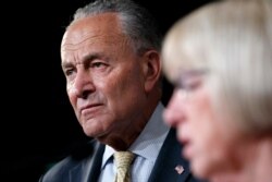 Senate Minority Leader Sen. Chuck Schumer of N.Y. (L) listens as Sen. Patty Murray, D-Wash., speaks at a news conference on proposed legislation regarding detention of immigrants on the southern border, July 11, 2019, Capitol Hill, Washington.