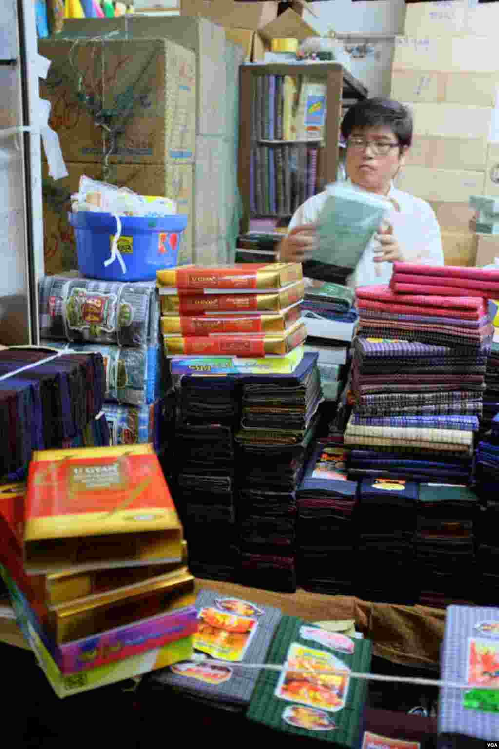 Maung Maung is a second-generation seller of longyi. (Steve Herman/VOA News)