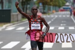 FILE - Eliud Kipchoge of Kenya crosses the finish line to win gold in the men's marathon at the Tokyo 2022 Olympics, in Sapporo, Japan, August 8, 2021.